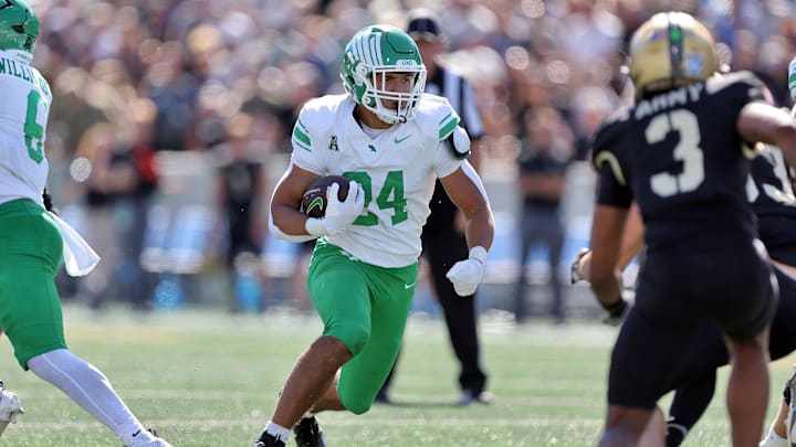 Sep 20, 2025; West Point, New York, USA; North Texas Mean Green running back Caleb Hawkins (24) runs for a touchdown against the Army Black Knights during the second half at Michie Stadium. 