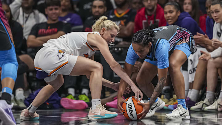 Aug 1, 2025; College Park, Georgia, USA; Phoenix Mercury guard Lexi Held (1) and Atlanta Dream guard Te-Hina Paopao (2) fight for the ball during the second half at Gateway Center Arena at College Park. Mandatory Credit: Dale Zanine-Imagn Images