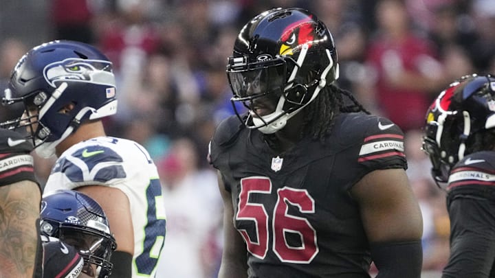 Arizona Cardinals defensive end Darius Robinson (56) walks back to the huddle during the fourth quarter against the Seattle Seahawks at State Farm Stadium in Glendale on Dec. 8, 2024. Arizona Cardinals defensive end Darius Robinson (56) walks back to the huddle during the fourth quarter against the Seattle Seahawks at State Farm Stadium in Glendale on Dec. 8, 2024.