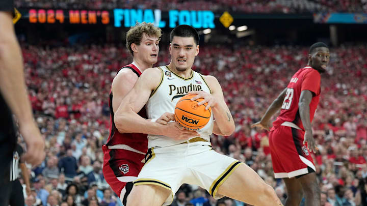 Purdue center Zach Edey (15) is defended by North Carolina State forward Ben Middlebrooks (34) Purdue center Zach Edey (15) is defended by North Carolina State forward Ben Middlebrooks (34)
