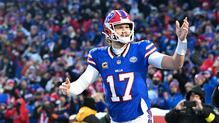 Buffalo Bills quarterback Josh Allen (17) runs onto the field before the game against the New York Jets at Highmark Stadium. 