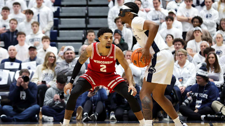 Jan 22, 2026; University Park, Pennsylvania, USA; Wisconsin Badgers guard Nick Boyd (2) defends Penn State Nittany Lions guard Kayden Mingo (4) during the first half at Rec Hall. 