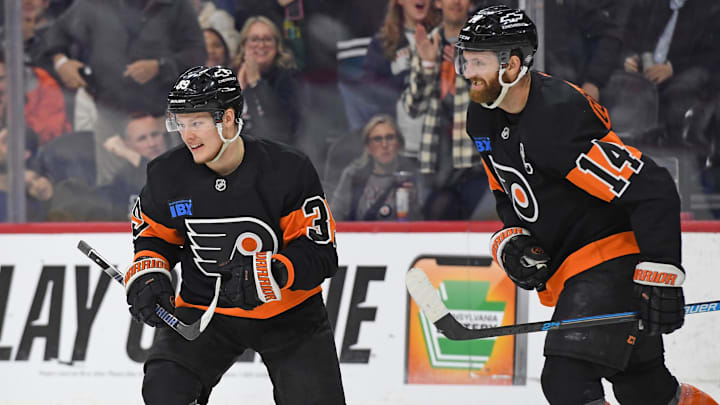 Mar 27, 2025; Philadelphia, Pennsylvania, USA; Philadelphia Flyers center Sean Couturier (14) celebrates his goal with right wing Matvei Michkov (39) against the Montreal Canadiens during the first period at Wells Fargo Center. Mandatory Credit: Eric Hartline-Imagn Images