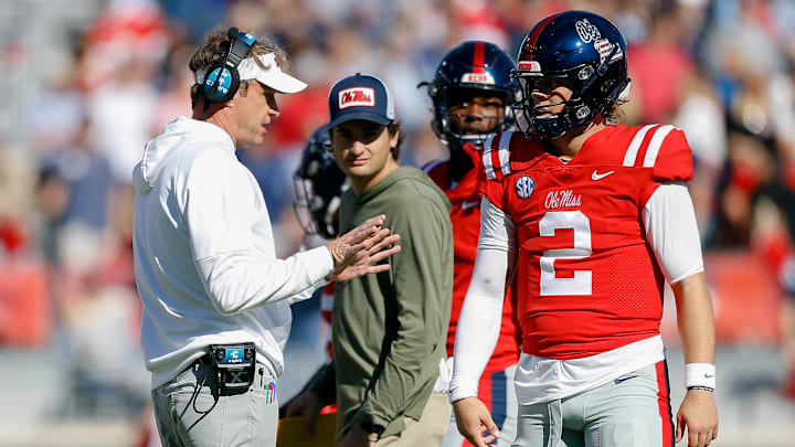 Mississippi Rebels head coach Lane Kiffin (left)