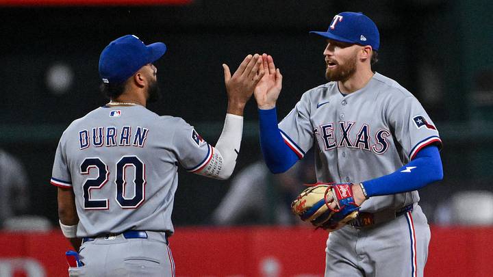 Texas Rangers right fielder Brandon Nimmo (24) celebrates with shortstop Ezequiel Duran,. Texas Rangers right fielder Brandon Nimmo (24) celebrates with shortstop Ezequiel Duran,.