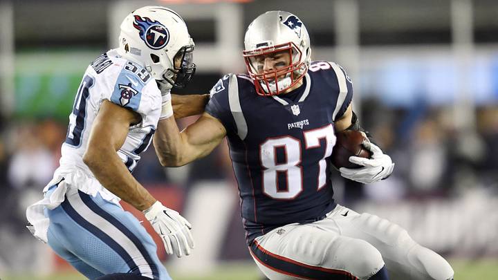 New England Patriots tight end Rob Gronkowski (87) attempts to push off Tennessee Titans linebacker Wesley Woodyard (59) after a big gain during the AFC Divisional Round playoff game at Gillette Stadium in Foxborough, Mass., Jan. 13, 2018. New England Patriots tight end Rob Gronkowski (87) attempts to push off Tennessee Titans linebacker Wesley Woodyard (59) after a big gain during the AFC Divisional Round playoff game at Gillette Stadium in Foxborough, Mass., Jan. 13, 2018.