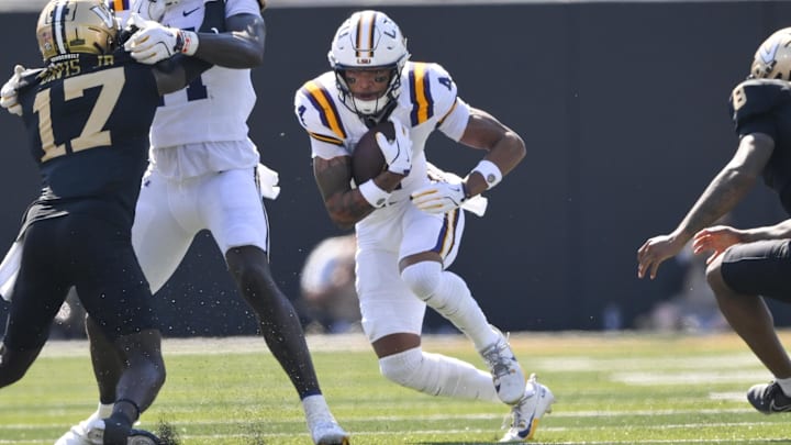 Oct 18, 2025; Nashville, Tennessee, USA;  Louisiana State Tigers wide receiver Nic Anderson (4) runs with the ball after a made catch against the Vanderbilt Commodores during the first half at FirstBank Stadium. Mandatory Credit: Steve Roberts-Imagn Images