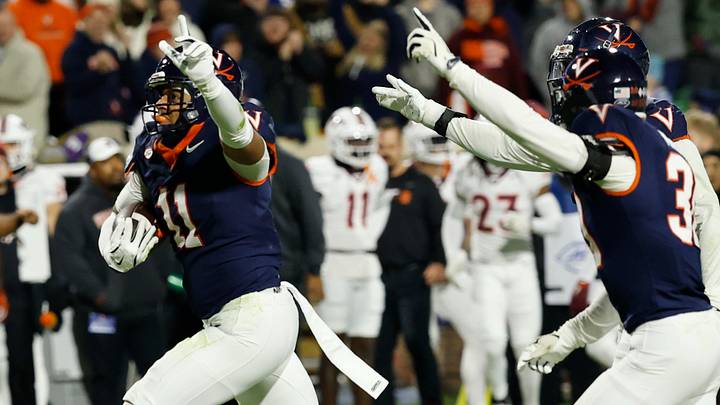 Nov 29, 2025; Charlottesville, Virginia, USA; Virginia Cavaliers linebacker Maddox Marcellus (11) celebrates after intercepting a pass against the Virginia Tech Hokies in the first quarter at Scott Stadium. Mandatory Credit: Geoff Burke-Imagn Images Nov 29, 2025; Charlottesville, Virginia, USA; Virginia Cavaliers linebacker Maddox Marcellus (11) celebrates after intercepting a pass against the Virginia Tech Hokies in the first quarter at Scott Stadium. Mandatory Credit: Geoff Burke-Imagn Images