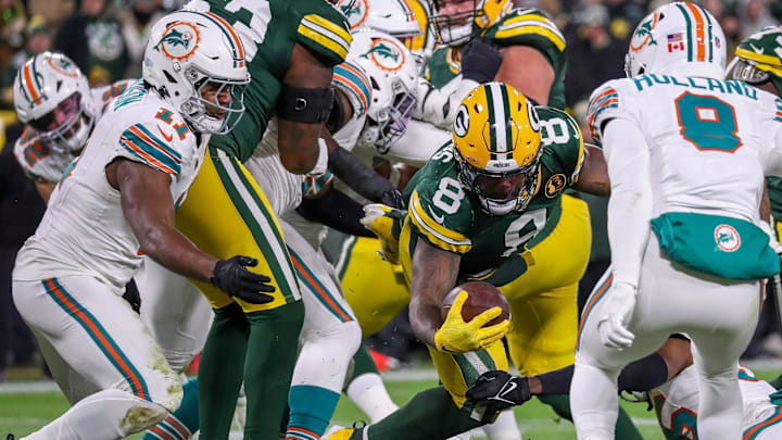 Green Bay Packers running back Josh Jacobs (8) reaches the ball across the goal line for a touchdown against the Miami Dolphins on Thursday, Nov. 28, 2024, at Lambeau Field in Green Bay, Wis. Green Bay Packers running back Josh Jacobs (8) reaches the ball across the goal line for a touchdown against the Miami Dolphins on Thursday, Nov. 28, 2024, at Lambeau Field in Green Bay, Wis.