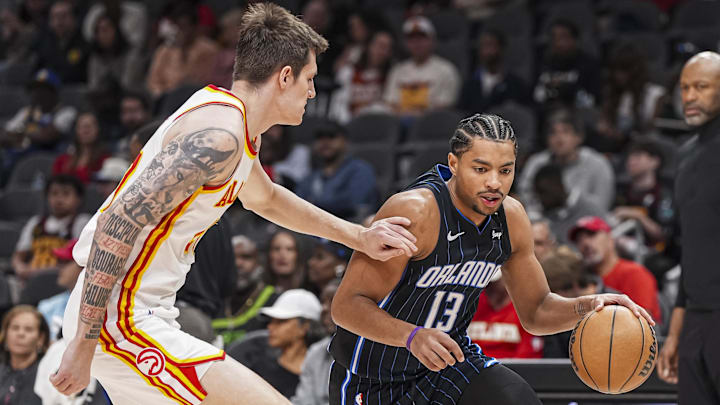 Orlando Magic guard Jett Howard (13) dribbles defended by Atlanta Hawks guard Vit Krejci (27) during the first half at State Farm Arena. Orlando Magic guard Jett Howard (13) dribbles defended by Atlanta Hawks guard Vit Krejci (27) during the first half at State Farm Arena.