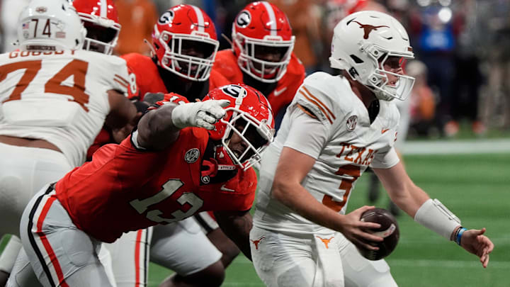 Georgia defensive lineman Mykel Williams (13) goes in for a sack on Texas quarterback Quinn Ewers (3) during the second half of the SEC championship game against Texas in Atlanta, on Saturday, Dec. 7, 2024.