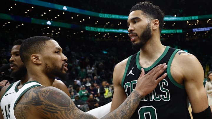Boston Celtics forward Jayson Tatum and Milwaukee Bucks guard Damian Lillard talk after a game at TD Garden