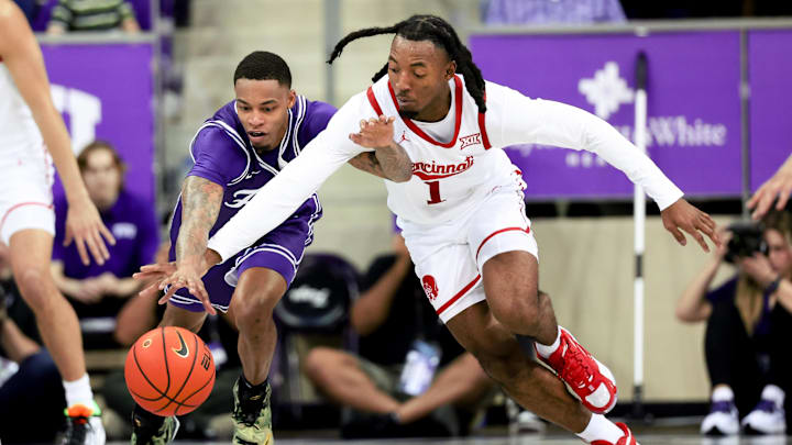 Feb 24, 2024; Fort Worth, Texas, USA; TCU Horned Frogs guard Avery Anderson III (3) and Cincinnati Bearcats guard Day Day Thomas (1) go for a loose ball during the second half at Ed and Rae Schollmaier Arena. Mandatory Credit: Kevin Jairaj-Imagn Images