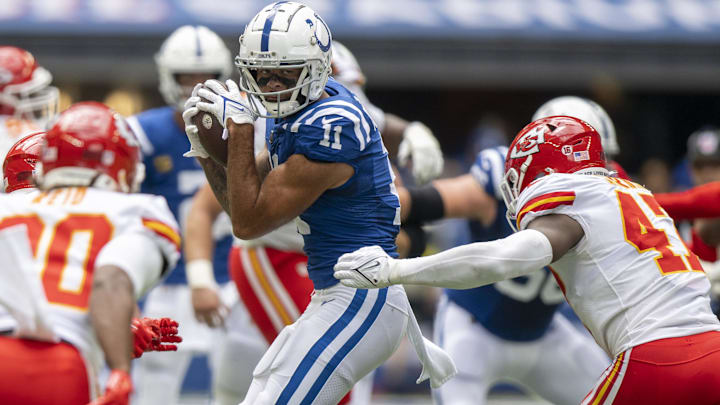 Sep 25, 2022; Indianapolis, Indiana, USA; Indianapolis Colts wide receiver Michael Pittman Jr. (11) catches a pass in front of Kansas City Chiefs linebacker Darius Harris (47) during the second quarter at Lucas Oil Stadium. Sep 25, 2022; Indianapolis, Indiana, USA; Indianapolis Colts wide receiver Michael Pittman Jr. (11) catches a pass in front of Kansas City Chiefs linebacker Darius Harris (47) during the second quarter at Lucas Oil Stadium.