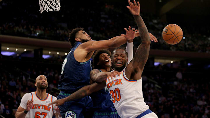 Jan 18, 2022; New York, New York, USA; New York Knicks forward Julius Randle (30) is fouled by Minnesota Timberwolves forward Jaden McDaniels (3) as he drives to the basket against McDaniels and center Karl-Anthony Towns (32) during the third quarter at Madison Square Garden. Mandatory Credit: Brad Penner-Imagn Images Jan 18, 2022; New York, New York, USA; New York Knicks forward Julius Randle (30) is fouled by Minnesota Timberwolves forward Jaden McDaniels (3) as he drives to the basket against McDaniels and center Karl-Anthony Towns (32) during the third quarter at Madison Square Garden. Mandatory Credit: Brad Penner-Imagn Images