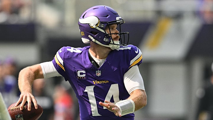 Sep 15, 2024; Minneapolis, Minnesota, USA; Minnesota Vikings quarterback Sam Darnold (14) in action against the San Francisco 49ers during the game at U.S. Bank Stadium.