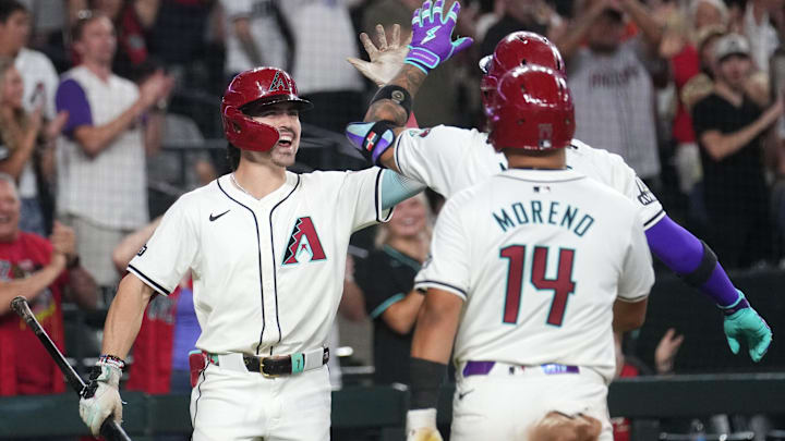 Arizona Diamondbacks Corbin Carroll (7) celebrates a 2-run home run by teammate Ketel Marte (4) against the San Diego Padres at Chase Field in Phoenix on Sept. 29, 2024.