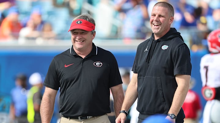 Oct 28, 2023; Jacksonville, Florida, USA; Florida Gators head coach Billy Napier and Georgia Bulldogs head coach Kirby Smart prior to the game at EverBank Stadium. Mandatory Credit: Kim Klement Neitzel-Imagn Images Oct 28, 2023; Jacksonville, Florida, USA; Florida Gators head coach Billy Napier and Georgia Bulldogs head coach Kirby Smart prior to the game at EverBank Stadium. Mandatory Credit: Kim Klement Neitzel-Imagn Images