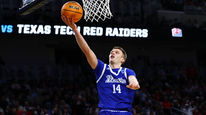 Mar 22, 2025; Wichita, KS, USA; Drake Bulldogs guard Bennett Stirtz (14) shoots the ball against the Texas Tech Red Raiders during the second half at Intrust Bank Arena. Mandatory Credit: Nick Tre. Smith-Imagn Images
