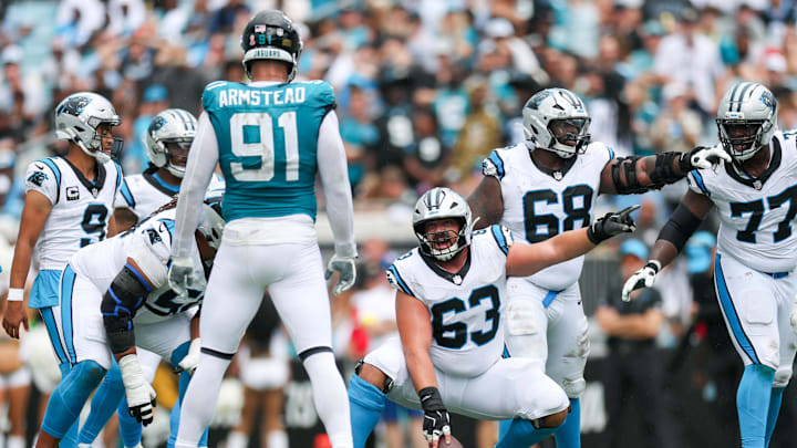 Sep 7, 2025; Jacksonville, Florida, USA; Carolina Panthers center Austin Corbett (63) and guard Damien Lewis (68) call out blocking assignments against the Jacksonville Jaguars during the first half at EverBank Stadium. Mandatory Credit: Nathan Ray Seebeck-Imagn Images Sep 7, 2025; Jacksonville, Florida, USA; Carolina Panthers center Austin Corbett (63) and guard Damien Lewis (68) call out blocking assignments against the Jacksonville Jaguars during the first half at EverBank Stadium. Mandatory Credit: Nathan Ray Seebeck-Imagn Images