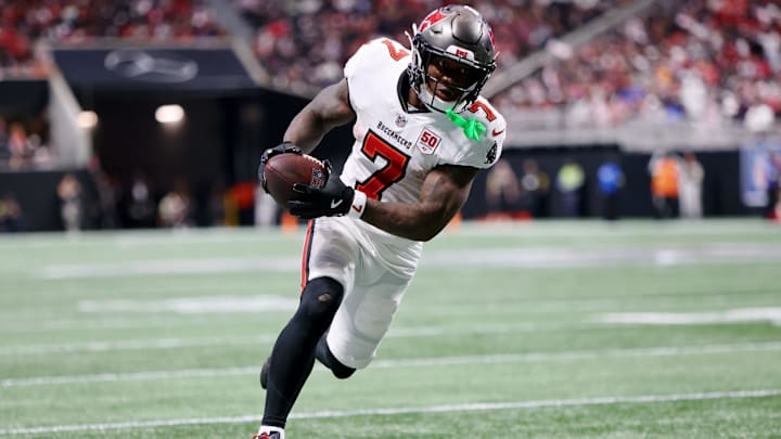 Sep 7, 2025; Atlanta, Georgia, USA; Tampa Bay Buccaneers running back Bucky Irving (7) runs with the ball for a touchdown against the Atlanta Falcons during the third quarter at Mercedes-Benz Stadium. 