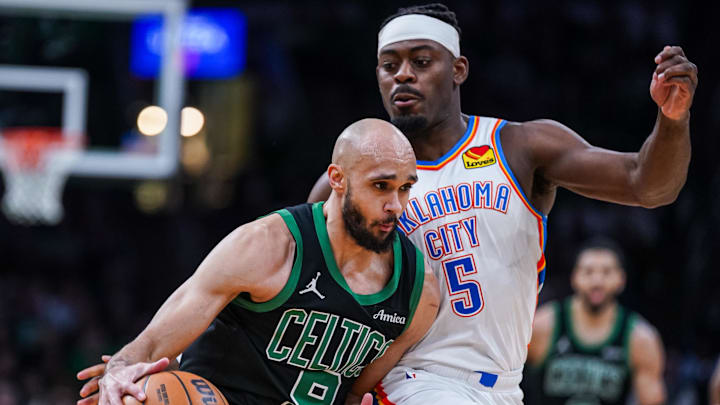 Mar 12, 2025; Boston, Massachusetts, USA; Boston Celtics guard Derrick White (9) drives the ball against Oklahoma City Thunder guard Luguentz Dort (5) in the second quarter at TD Garden. Mar 12, 2025; Boston, Massachusetts, USA; Boston Celtics guard Derrick White (9) drives the ball against Oklahoma City Thunder guard Luguentz Dort (5) in the second quarter at TD Garden.