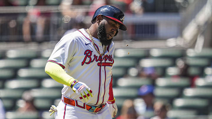 Aug 25, 2024; Cumberland, Georgia, USA; Atlanta Braves designated hitter Marcell Ozuna (20) reacts after being hit by a foul ball against the Washington Nationals during the eighth inning at Truist Park. Mandatory Credit: Dale Zanine-USA TODAY Sports