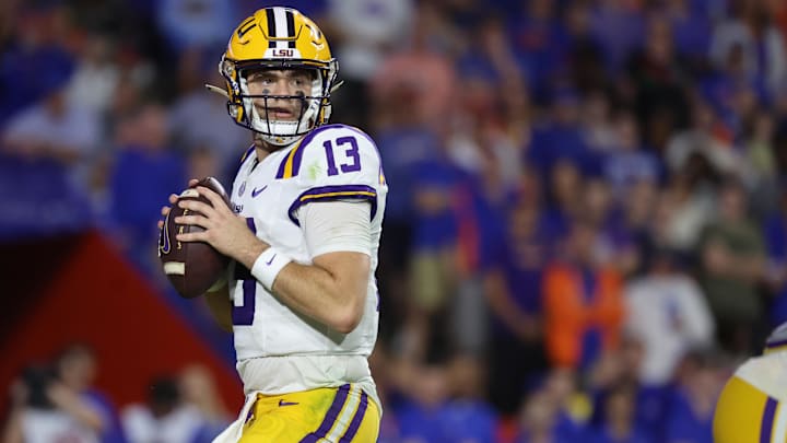 Nov 16, 2024; Gainesville, Florida, USA; LSU Tigers quarterback Garrett Nussmeier (13) drops back against the Florida Gators during the second half at Ben Hill Griffin Stadium. Mandatory Credit: Kim Klement Neitzel-Imagn Images