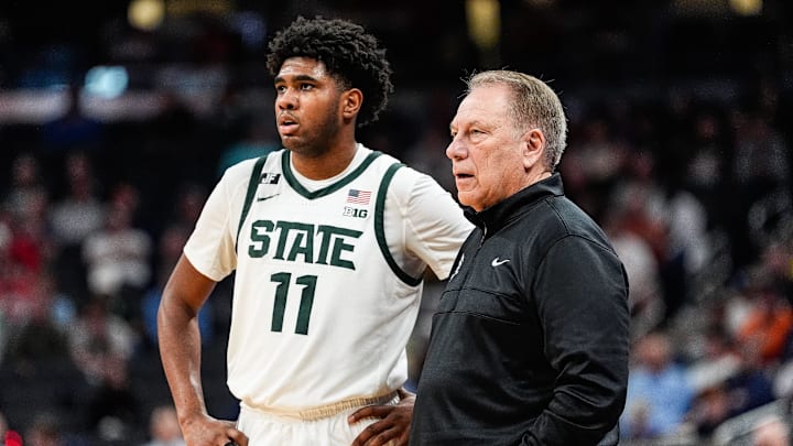 Michigan State guard Jase Richardson (11) watches a play against Oregon next to head coach Tom Izzo during the second half of Big Ten Tournament quarterfinal at Gainbridge Fieldhouse in Indianapolis, Ind. on Friday, March 14, 2025.