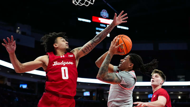 Ohio State Buckeyes forward Devin Royal (21) shoots the ball against Wisconsin Badgers guard Braeden Carrington (0) in the first half of the NCAA game at Value City Arena on Tuesday, Feb. 17, 2026 in Columbus, Ohio.