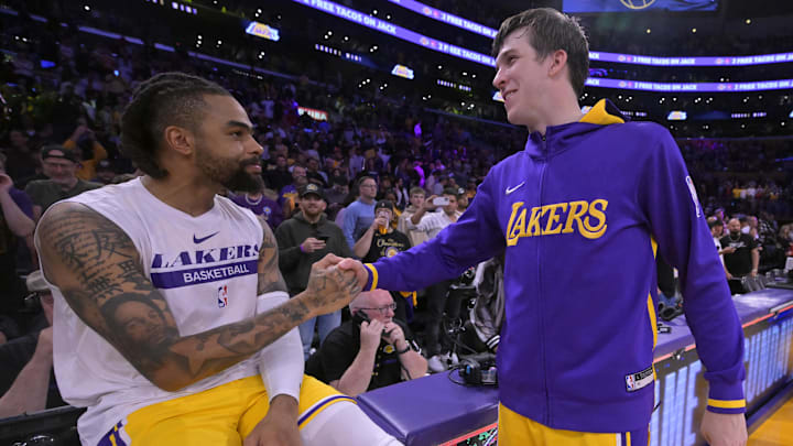 May 12, 2023; Los Angeles, California, USA;  Los Angeles Lakers guard D'Angelo Russell (1) and guard Austin Reaves (15) celebrate after winning game six of the 2023 NBA playoffs against the Golden State Warriors at Crypto.com Arena. Mandatory Credit: Jayne Kamin-Oncea-Imagn Images