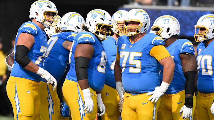 Nov 10, 2024; Inglewood, California, USA; Los Angeles Chargers offensive tackle Joe Alt (76), quarterback Justin Herbert (10), guard Jamaree Salyer (68), fullback Scott Matlock (44), center Bradley Bozeman (75), guard Zion Johnson (77), and offensive tackle Rashawn Slater (70) during and NFL game against the Tennessee Titans at SoFi Stadium. Mandatory Credit: Robert Hanashiro-Imagn Images