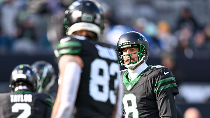 Dec 1, 2024; East Rutherford, New Jersey, USA; New York Jets quarterback Aaron Rodgers (8) warms up with tight end Tyler Conklin (83) before the game against the Seattle Seahawks at MetLife Stadium. 