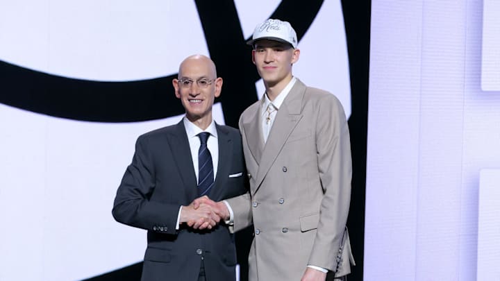 Jun 25, 2025; Brooklyn, NY, USA;  Egor Demin stands with NBA commissioner Adam Silver after being selected as the eighth pick by the Brooklyn Nets in the first round of the 2025 NBA Draft at Barclays Center. Mandatory Credit: Brad Penner-Imagn Images