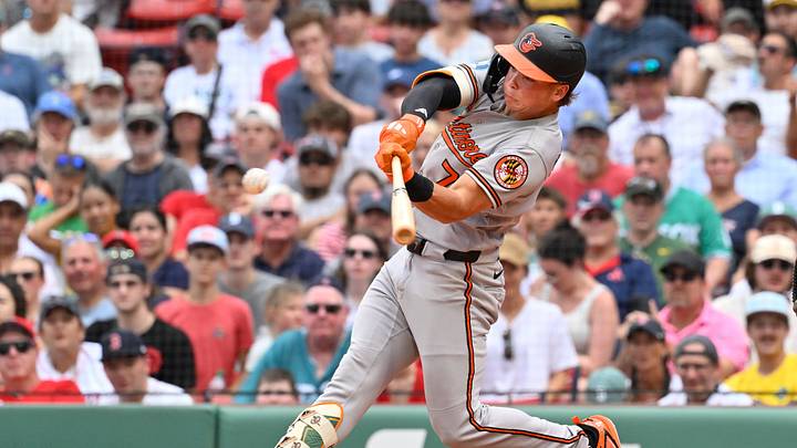 Jul 22, 2026; Boston, Massachusetts, USA; Baltimore Orioles second baseman Jackson Holliday (7) hits a single against the Boston Red Sox during the ninth inning at Fenway Park. Mandatory Credit: Eric Canha-Imagn Images