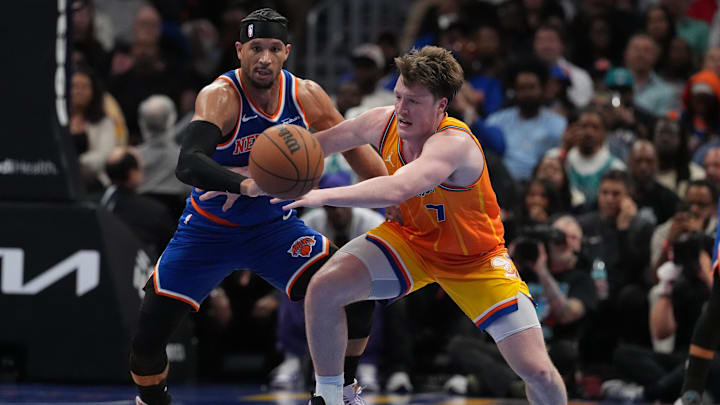 Mar 26, 2026; Charlotte, North Carolina, USA; Charlotte Hornets guard/forward Kon Knueppel (7) fights for possession with New York Knicks guard Josh Hart (3) during the second half at the Spectrum Center. Mandatory Credit: Jim Dedmon-Imagn Images