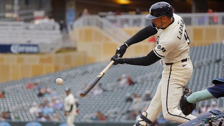 Jun 26, 2025; Minneapolis, Minnesota, USA; Minnesota Twins designated hitter Trevor Larnach (9) hits a two run home run against the Seattle Mariners in the fifth inning at Target Field.