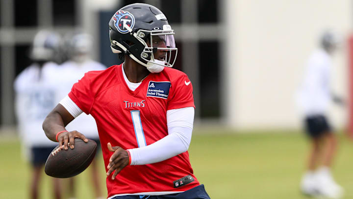 May 10, 2025; Nashville, TN, USA; Tennessee Titans quarterback Cam Ward (1) throws a pass as he goes through drills during Rookie Mini Camp at Saint Thomas Sports Park. Mandatory Credit: Steve Roberts-Imagn Images May 10, 2025; Nashville, TN, USA; Tennessee Titans quarterback Cam Ward (1) throws a pass as he goes through drills during Rookie Mini Camp at Saint Thomas Sports Park. Mandatory Credit: Steve Roberts-Imagn Images