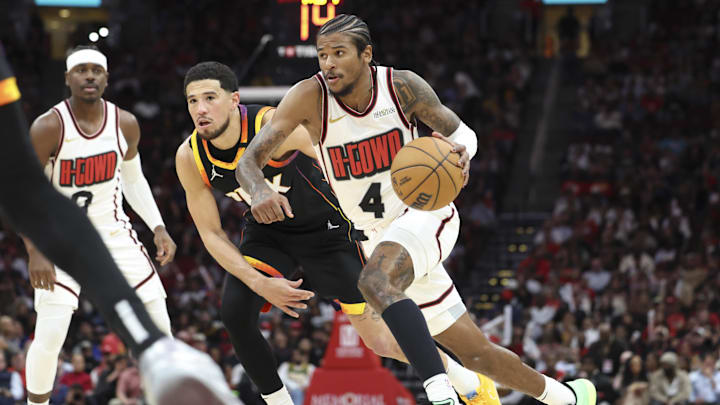 Houston Rockets guard Jalen Green drives against Phoenix Suns guard Devin Booker 