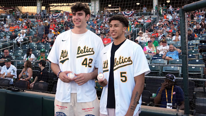Jul 5, 2025; West Sacramento, California, USA; Sacramento Kings draft picks Maxime Raynaud (left) and Nique Clifford (right) pose for a photo before the game between the Athletics and the San Francisco Giants at Sutter Health Park. Mandatory Credit: Darren Yamashita-Imagn Images