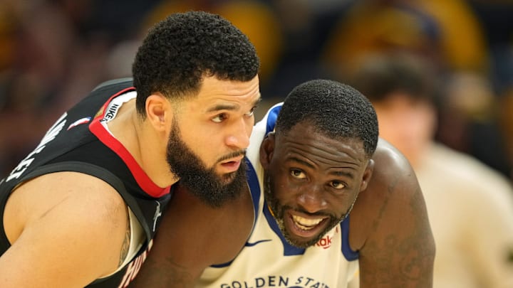 Apr 26, 2025; San Francisco, California, USA; Houston Rockets guard Fred VanVleet (left) defends against Golden State Warriors forward Draymond Green (23) during the fourth quarter of game three of first round for the 2024 NBA Playoffs at Chase Center. Mandatory Credit: Darren Yamashita-Imagn Images