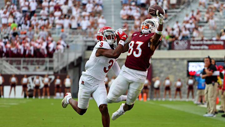 Sep 21, 2024; Blacksburg, Virginia, USA; Virginia Tech Hokies wide receiver Jaylin Lane (83) jumps for a pass against Rutgers Scarlet Knights defensive back Bo Mascoe (3) during the third quarter at Lane Stadium. Mandatory Credit: Peter Casey-Imagn Images Sep 21, 2024; Blacksburg, Virginia, USA; Virginia Tech Hokies wide receiver Jaylin Lane (83) jumps for a pass against Rutgers Scarlet Knights defensive back Bo Mascoe (3) during the third quarter at Lane Stadium. Mandatory Credit: Peter Casey-Imagn Images