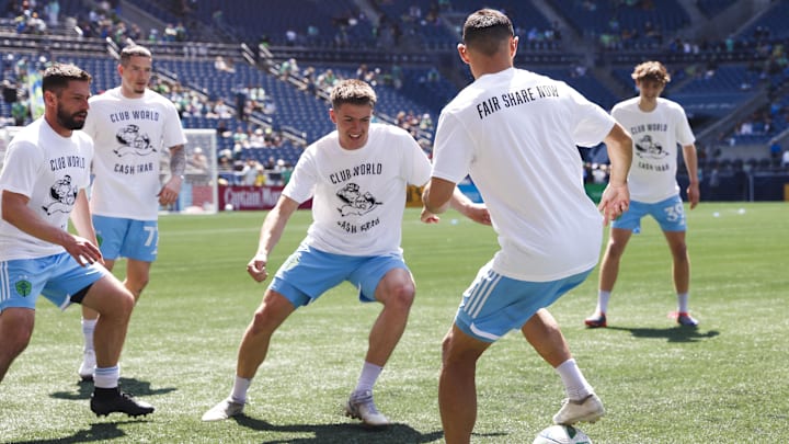 Seattle Sounders FC players wear "Club World Cash Grab" shirts during warmups against Minnesota United.
