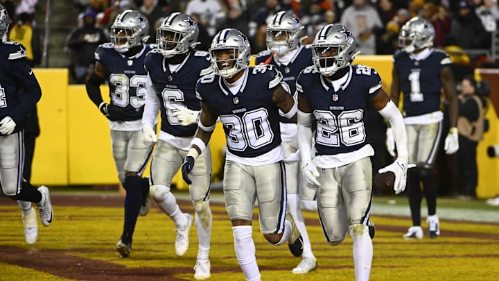 Jan 7, 2024; Landover, Maryland, USA; Dallas Cowboys cornerback DaRon Bland (26) celebrates after