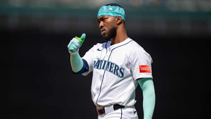 Apr 30, 2025; Seattle, Washington, USA;  Seattle Mariners right fielder Samad Taylor (0) gestures to the dugout after a bunt base hit during the seventh inning against the Los Angeles Angels at T-Mobile Park. Mandatory Credit: Stephen Brashear-Imagn Images