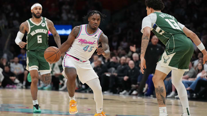 Apr 5, 2025; Miami, Florida, USA; Miami Heat guard Davion Mitchell (45) brings the ball up the court as Milwaukee Bucks guard Ryan Rollins (13) defends during the first half at Kaseya Center. Mandatory Credit: Jim Rassol-Imagn Images Apr 5, 2025; Miami, Florida, USA; Miami Heat guard Davion Mitchell (45) brings the ball up the court as Milwaukee Bucks guard Ryan Rollins (13) defends during the first half at Kaseya Center. Mandatory Credit: Jim Rassol-Imagn Images