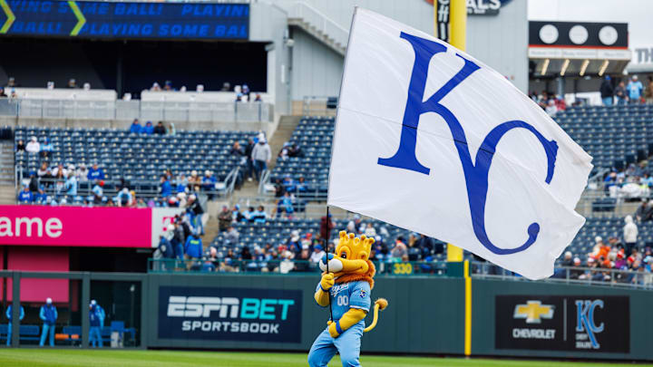 Apr 5, 2025; Kansas City, Missouri, USA; Kansas City Royals mascot Sluggerrr waves the flag prior to the game against the Baltimore Orioles at Kauffman Stadium. Mandatory Credit: William Purnell-Imagn Images Apr 5, 2025; Kansas City, Missouri, USA; Kansas City Royals mascot Sluggerrr waves the flag prior to the game against the Baltimore Orioles at Kauffman Stadium. Mandatory Credit: William Purnell-Imagn Images
