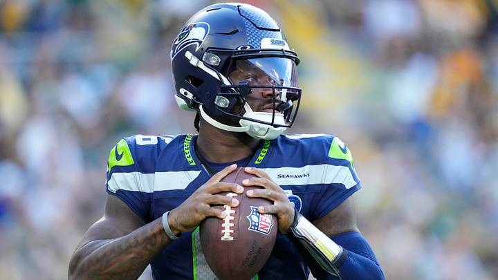 Seattle Seahawks quarterback Jalen Milroe warms up near the sidelines during the game against the Green Bay Packers. Seattle Seahawks quarterback Jalen Milroe warms up near the sidelines during the game against the Green Bay Packers.