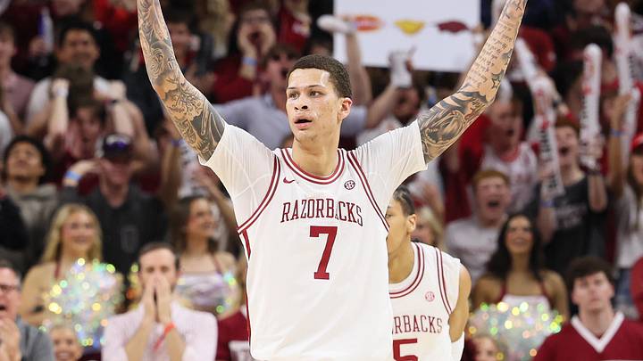 Mar 4, 2026; Fayetteville, Arkansas, USA; Arkansas Razorbacks forward Trevon Brazile (7) celebrates after a play against the Texas Longhorns during the first half at Bud Walton Arena. Mandatory Credit: Nelson Chenault-Imagn Images