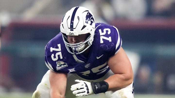 Dec 26, 2024; Phoenix, AZ, USA; Kansas State Wildcats offensive lineman Sam Hecht (75) against the Rutgers Scarlet Knights during the Rate Bowl at Chase Field. Mandatory Credit: Mark J. Rebilas-Imagn Images